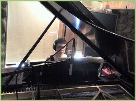 About Mary Feinsinger - Mary playing piano in recording studio